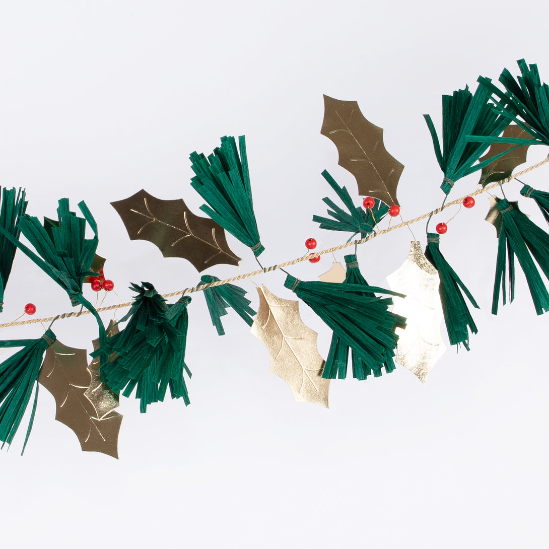 Our festive garland includes holly, berries and pine needles crafted from paper and wooden beads for a special Christmas foliage look.