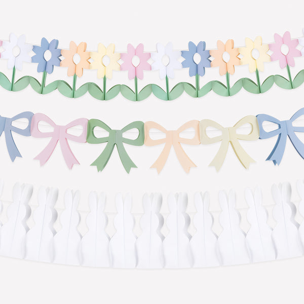 Our Easter garland set features three paper garlands, with bows, bunnies and flowers in springtime colours.  Team together, or style separately. Image1