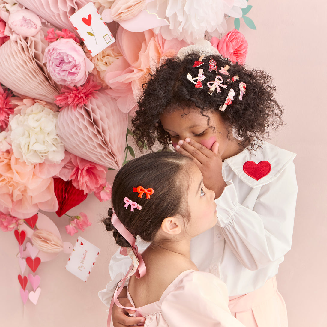 Our glitter hair clips, with pink and red glitter fabric, hearts, bows and a rainbow, are perfect as Valentine's gifts.