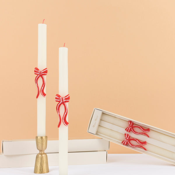 Our decorative candles feature striking pink and red bows and red wicks, ideal for your table or mantel or as a Christmas host gift. Image1