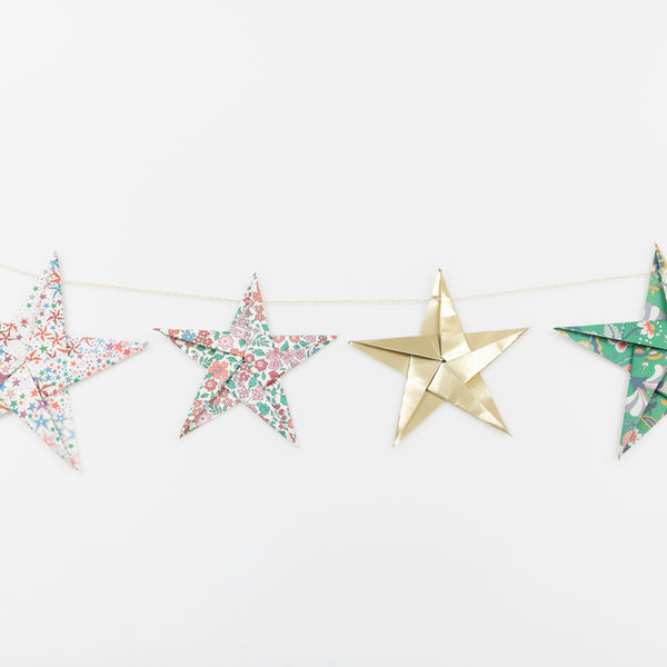 Let our star garland, designed with joyful Liberty star and floral prints and gold foil details, add an elegant touch to your Christmas décor. Image3