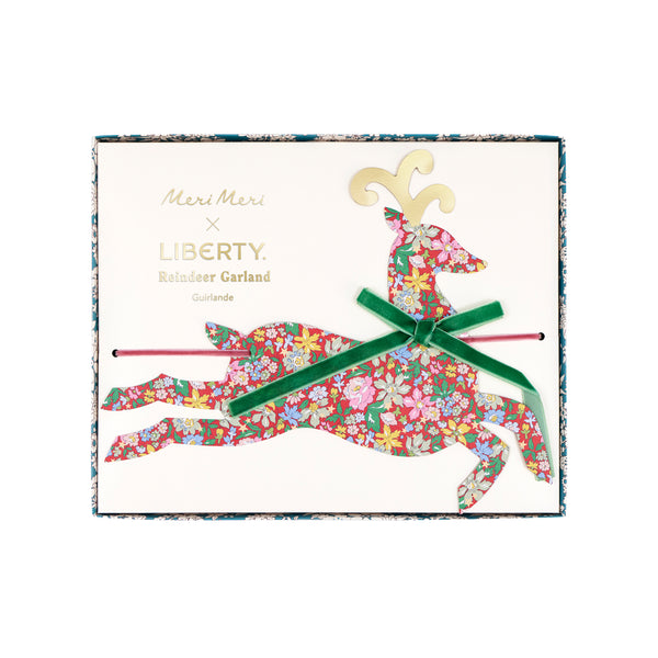 Our Christmas garland, featuring paper reindeers with elegant Liberty print designs and velvet ribbon bows, is perfect to reuse year after year. Image3