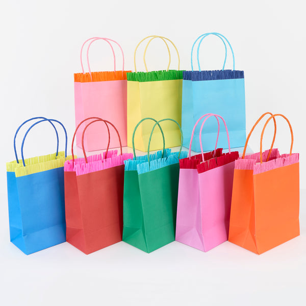 Our party favour bags come in eight vibrant colours, with matching twisted paper handles and delightful crepe paper fringing. Image1