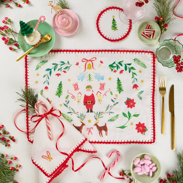 Our fabric cocktail napkins for Christmas are made with a linen and cotton blend, festive motifs, red crochet borders and gold embroidery. Image2