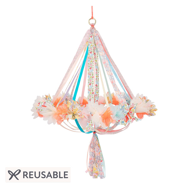 This hanging flower decoration is made from colourful fabric with streamers. Image1