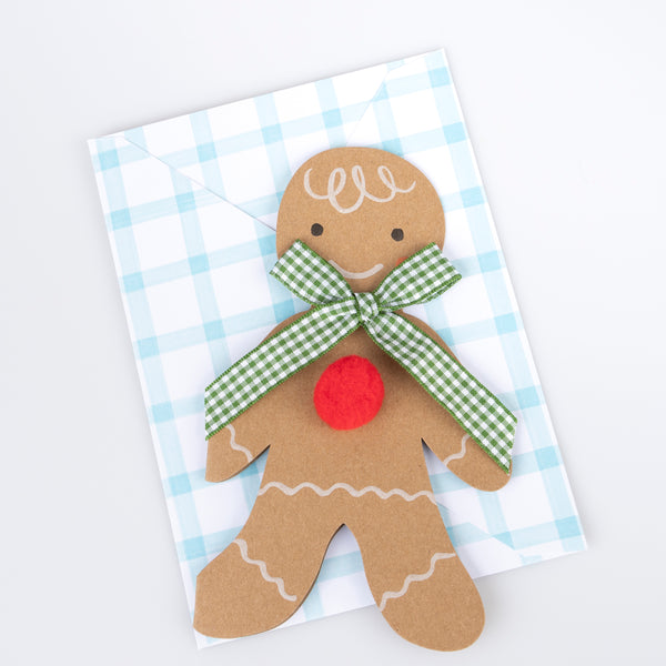 Our Christmas card, in the shape of a gingerbread man with a gingham ribbon bow, makes a great Christmas mantel decoration. Image4