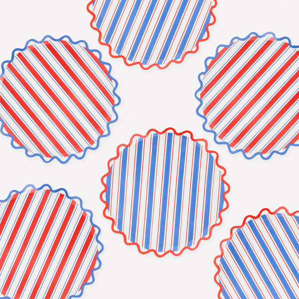 Our side plates, made from paper with a wavy edge, feature bright nautical stripes in red, blue and white, ideal for summery gatherings. Image1