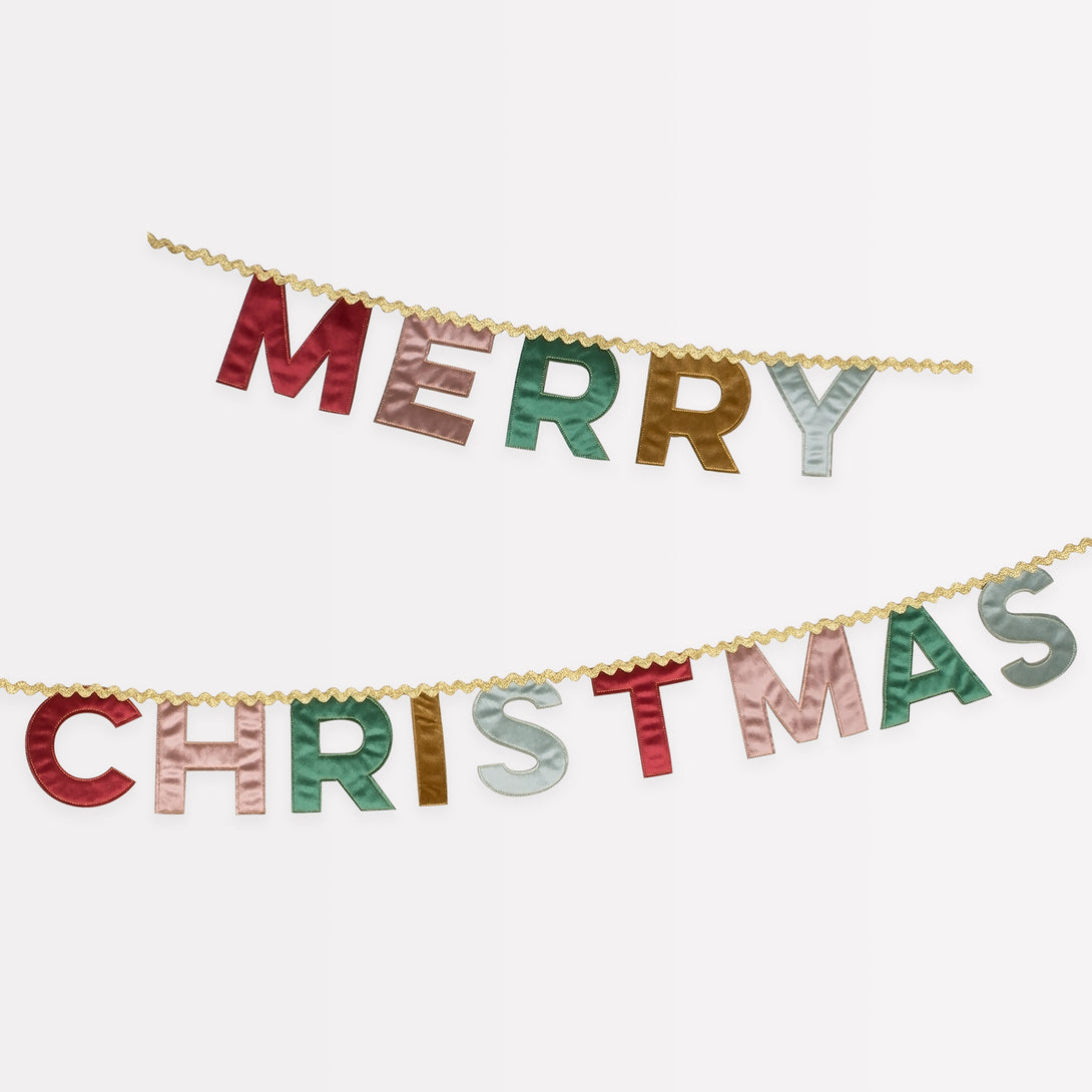 Our Merry Christmas garland is made in velvet with a mix of traditional and modern colours and metallic gold ric rac.