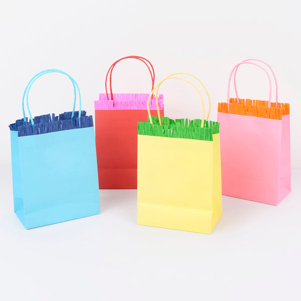 Our party favour bags come in eight vibrant colours, with matching twisted paper handles and delightful crepe paper fringing. Image2