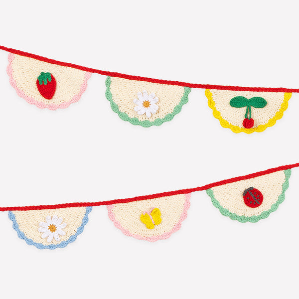 Our crochet garland features scalloped pennants with colourful designs, presented in an organza drawstring bag, a beautiful decoration. Image1