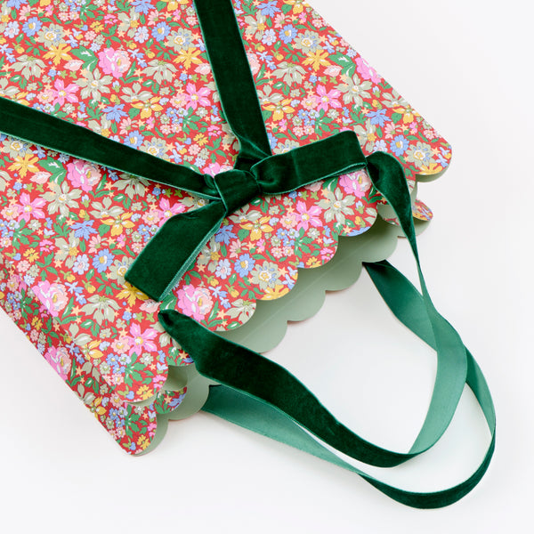 Our paper Christmas gift bags feature beautiful Liberty print designs for an elegant look, with three designs, velvet ribbon bows and handles. Image2