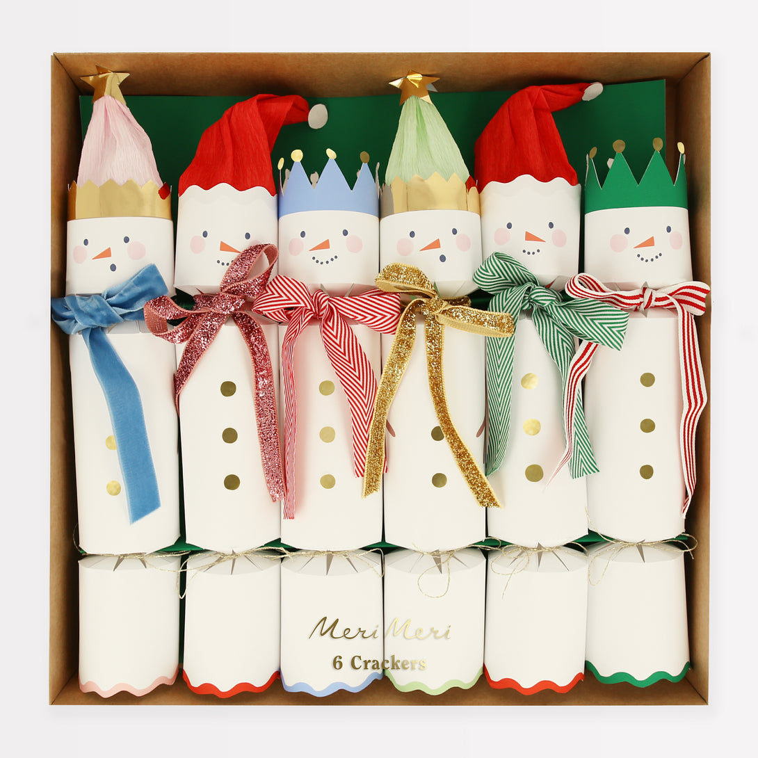 Our fun Christmas crackers have fun snowmen details with hat and scarf embelllishments, and contain fabulous erasers, party hats and jokes.