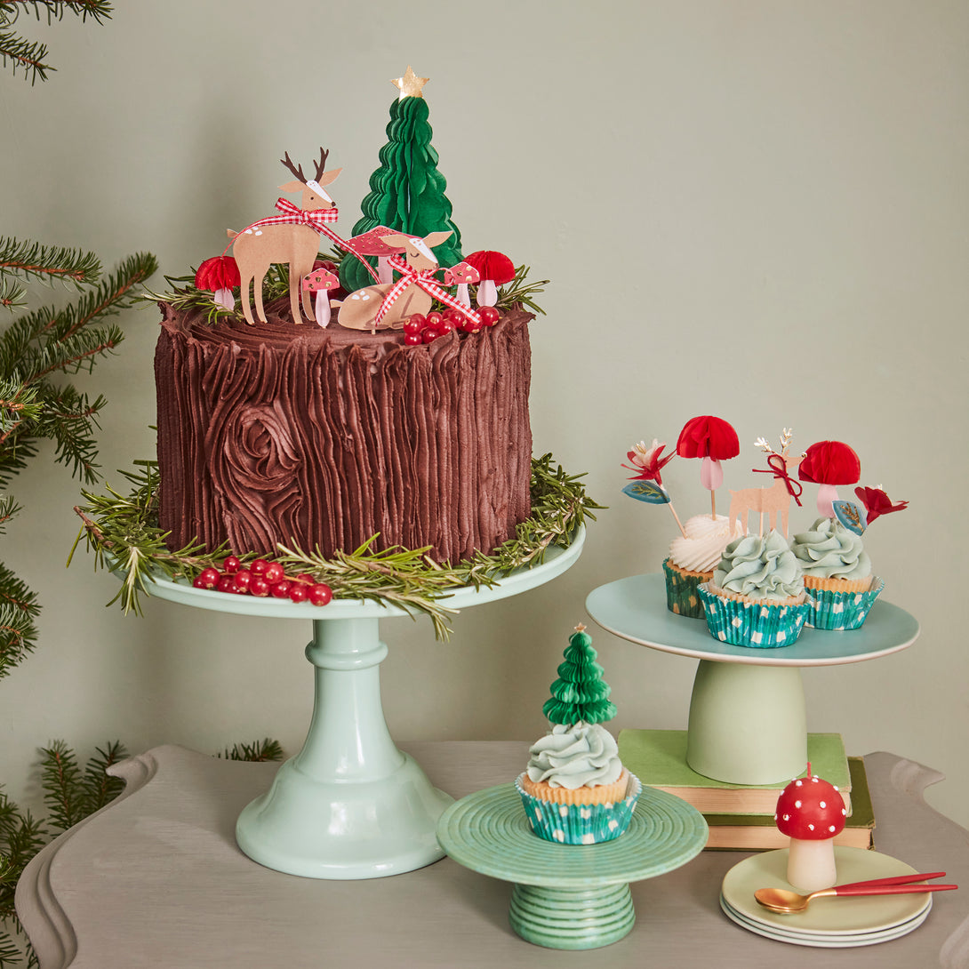 Our special Christmas cupcake kit contains woodland animals, flowers and Christmas tree toppers with striped cupcake cases.