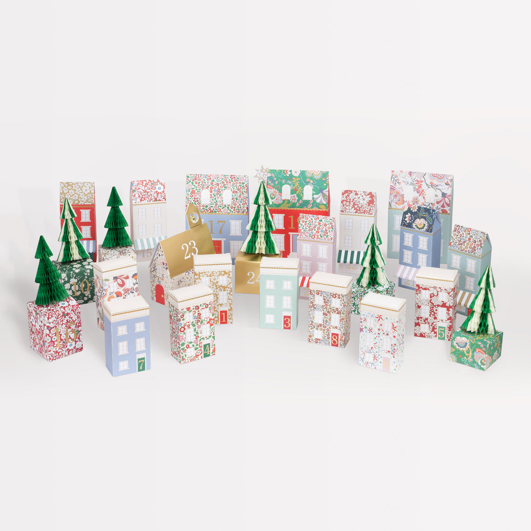 Our Christmas advent calendar creates a 3D village scene, with Liberty prints, shiny gold foil details and honeycomb trees, to fill with fun gifts. Image1