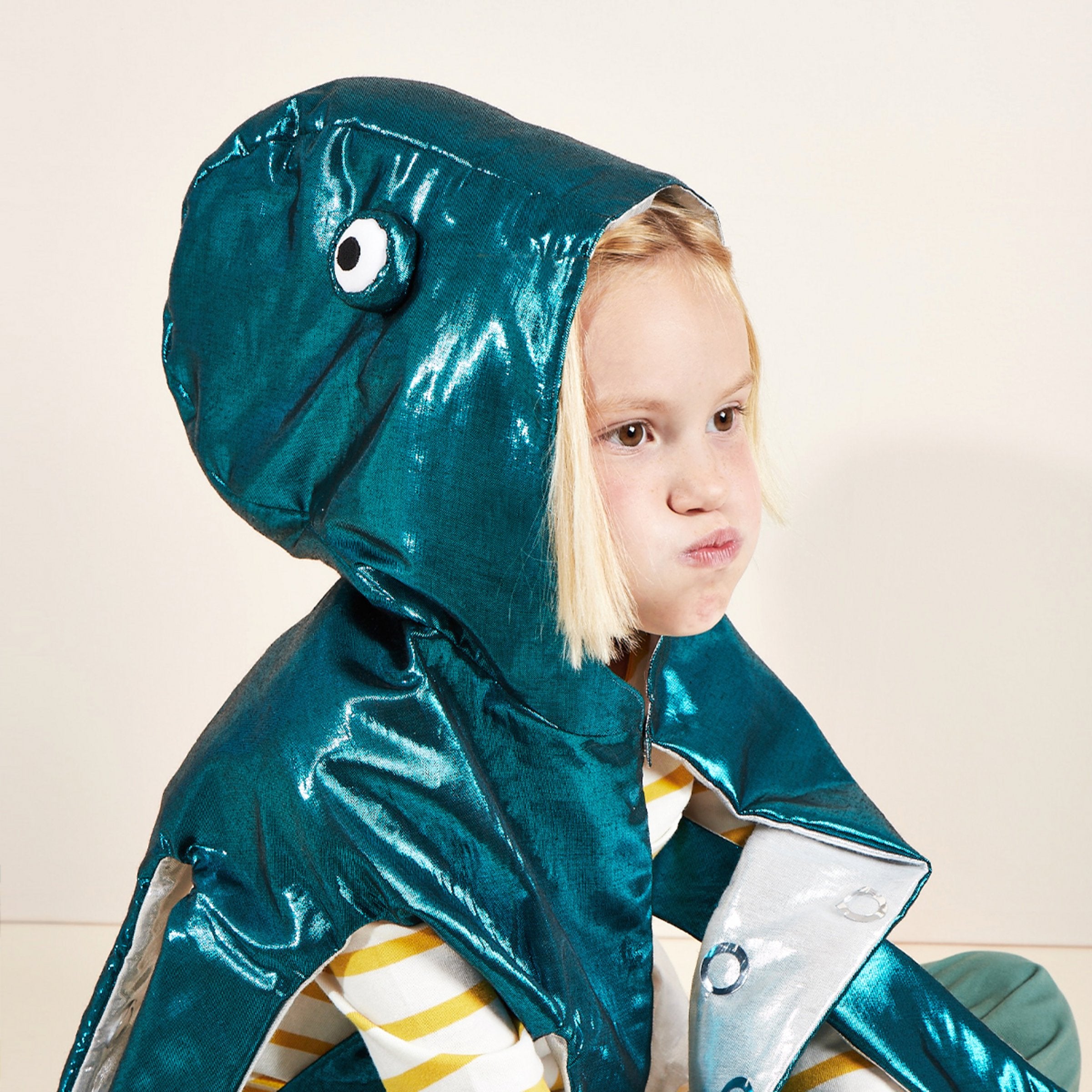 This sensational shiny under-the-sea costume is crafted from lame fabric, and has 3D eyes.