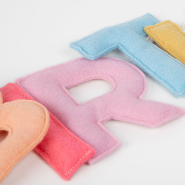 Add a rainbow of colour to your birthday party supplies with a colourful felt garland, paper tablecloth and bright birthday cake candles.  Image5