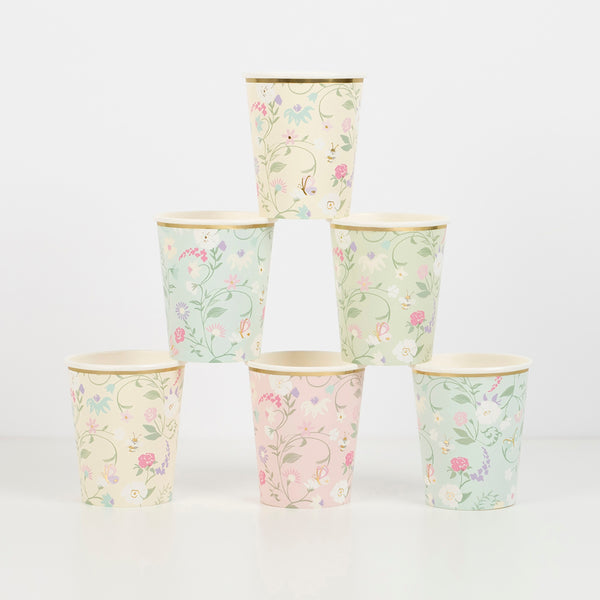 Beautiful pastel floral plates, cups, napkins, floral garland, and gold candles.  Image9