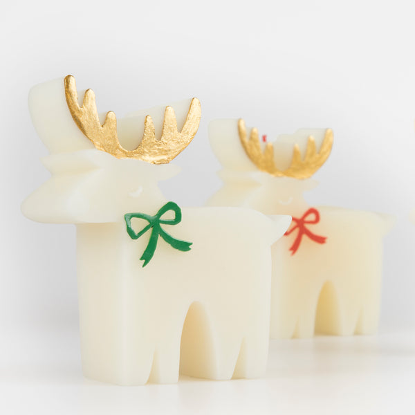 These Christmas table candles are reindeers with on-trend bows, gold details and fabulous coloured wicks, a great host gift. Image3