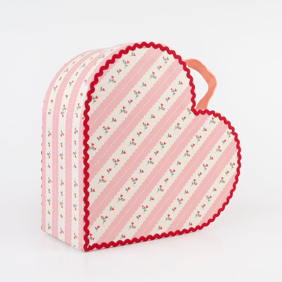 Our kids accessories feature heart suitcases in pink, red and white with soft velvet handles.