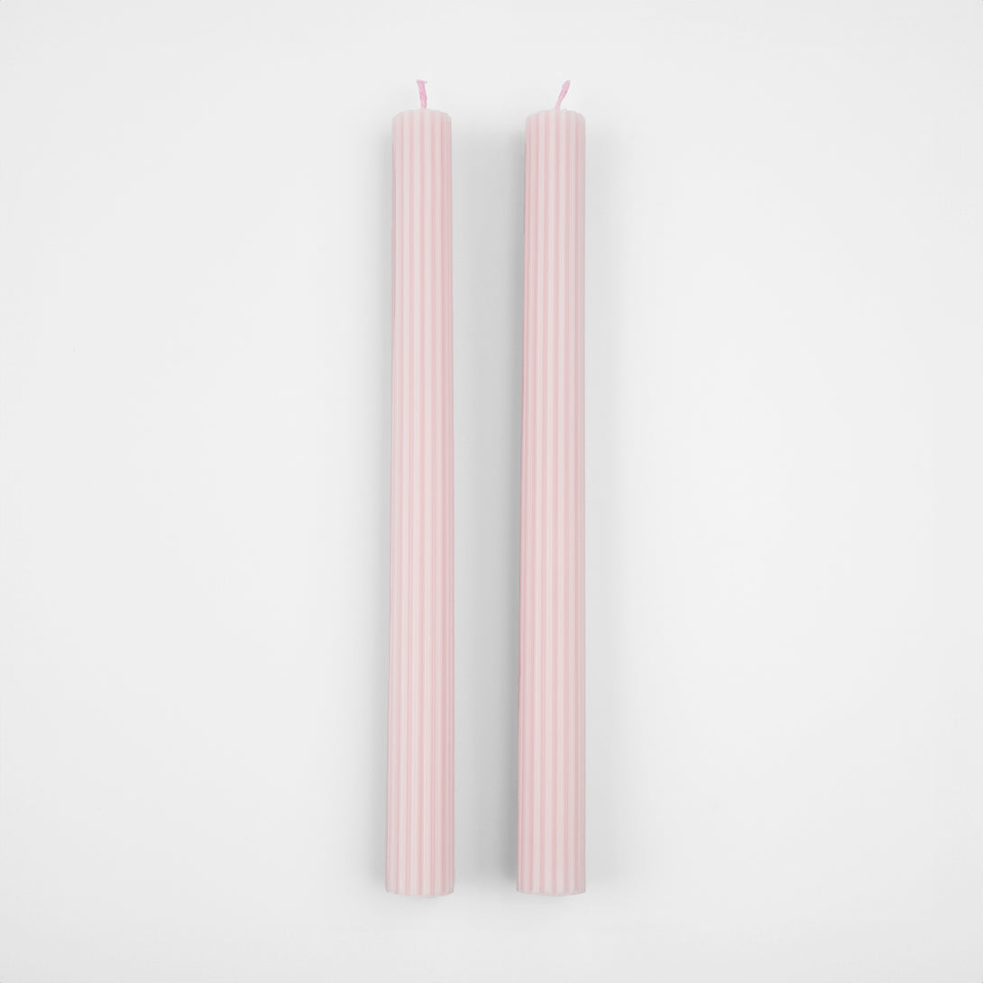 Our tall candles, in a pink colour with ridged details, add a stunning look to any party.