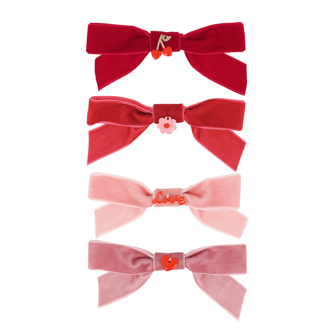 Our Valentine's hair accessories, made with soft velvet bows and enamel charms, make great Valentine's day gifts.