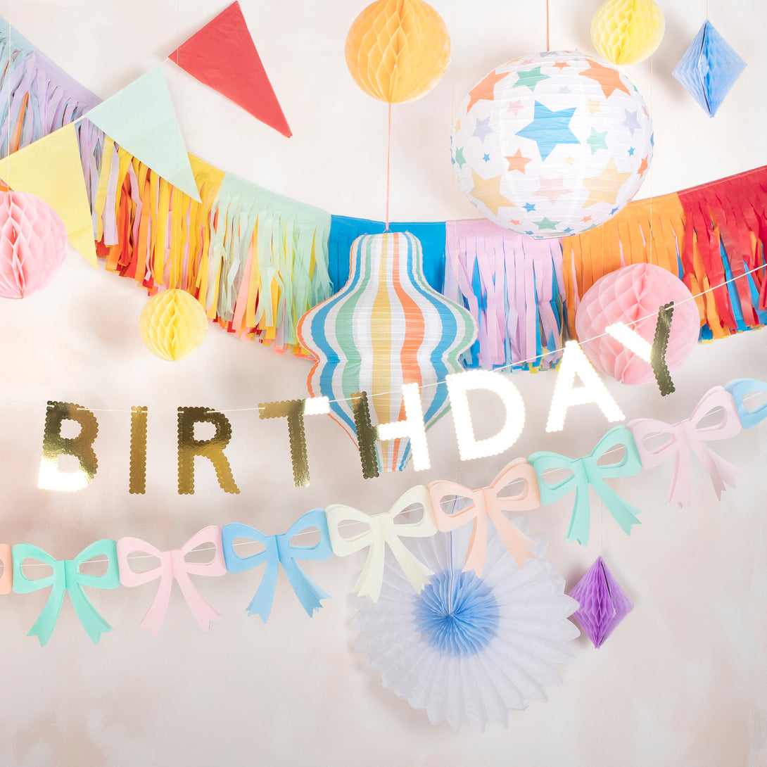 Our birthday garland, in shiny gold letters, is a great birthday party decoration to place on the party table, wall, mantel or doorway.