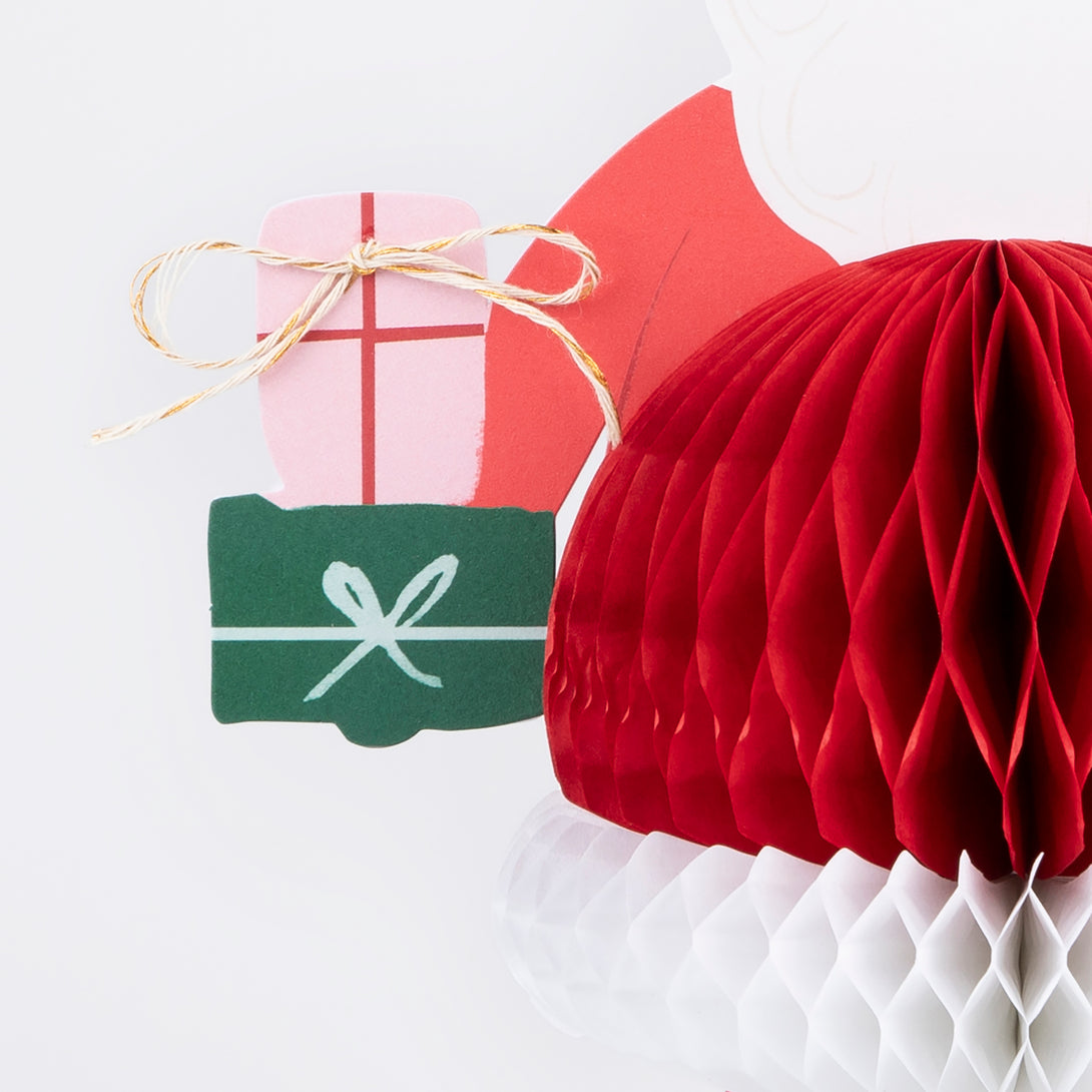 Our Santa card, with honeycomb and metallic twine details, will look amazing as part of your Christmas card display.