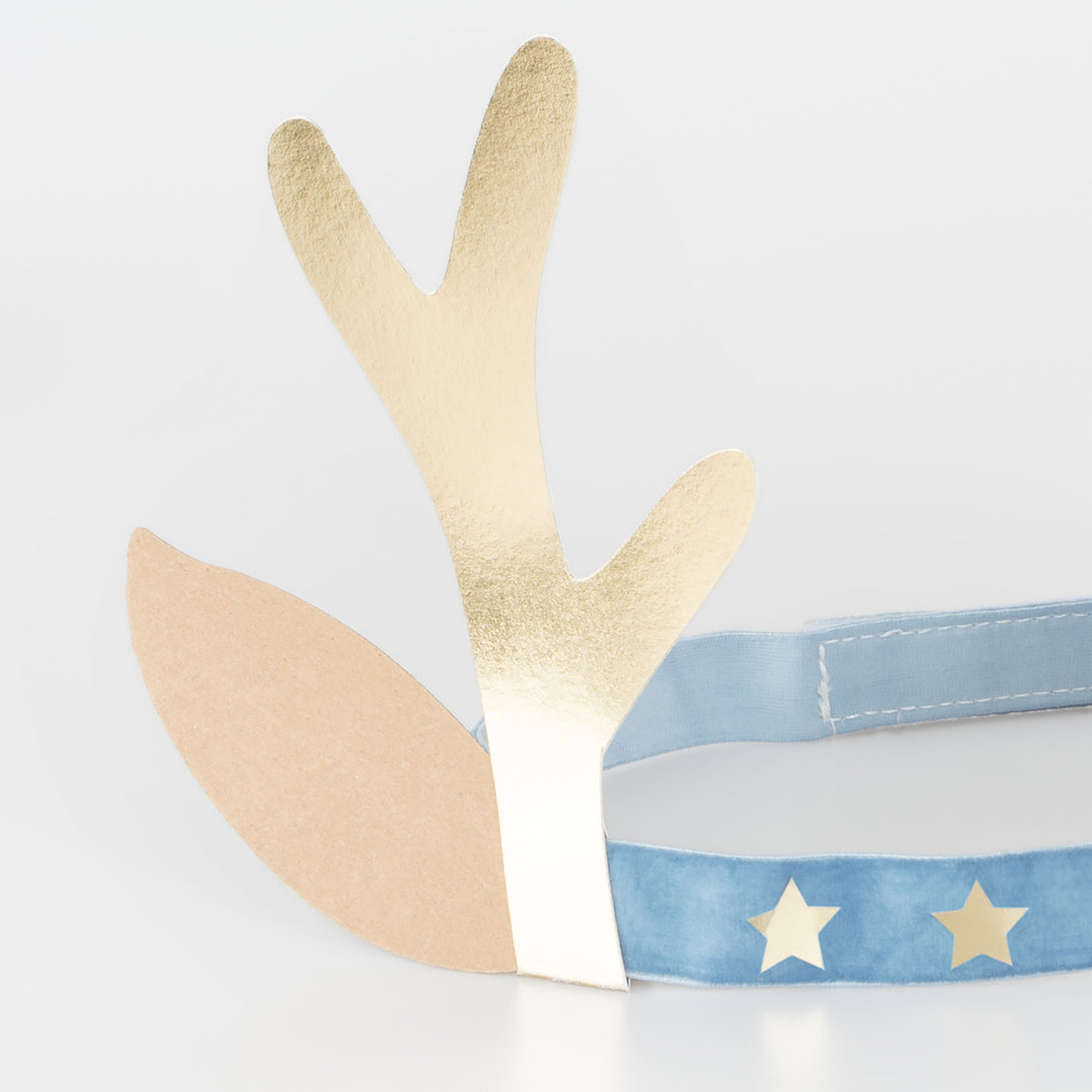 Our antler headbands, with velvet bands, shiny gold stars and antlers, and reindeer ears, make fun Christmas headwear.