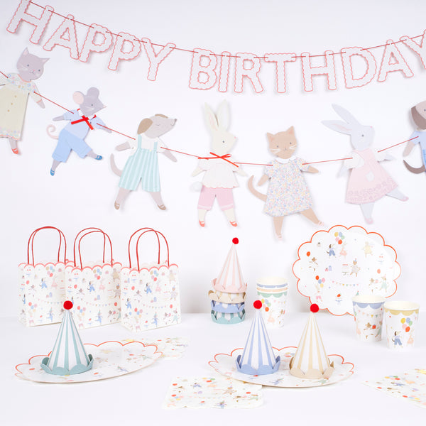 Our Animal Friends party set is ideal for first birthdays, featuring adorable tableware, party bags, party hats and a large paper garland. 