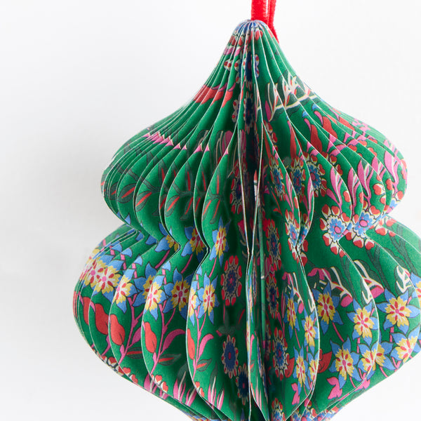 Our Christmas tree decorations, in elegant ornamental shapes, have honeycomb details and beautiful Liberty print designs in festive colours. Image3