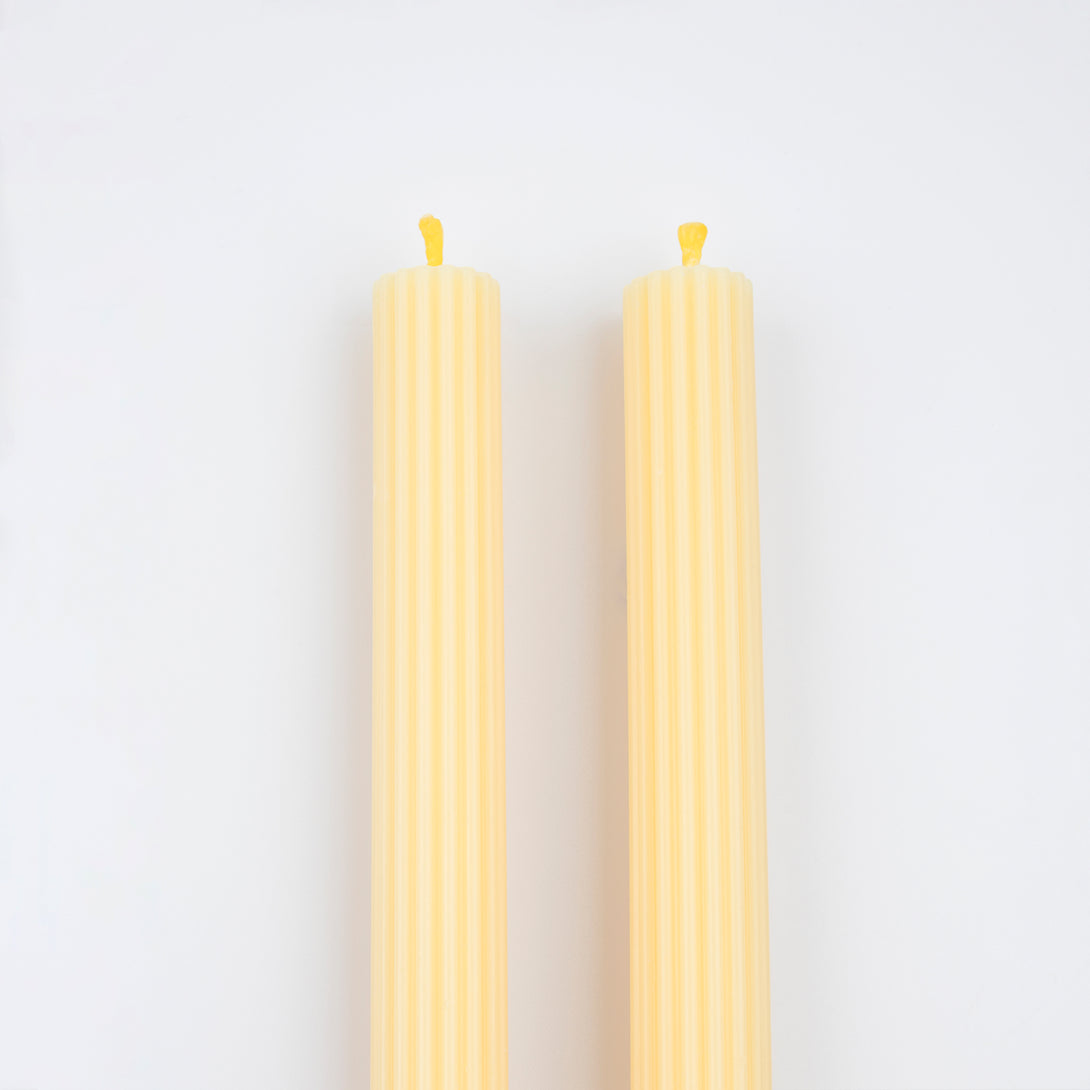 Our long candles, in a cheery yellow, look amazing on the mantel or table.