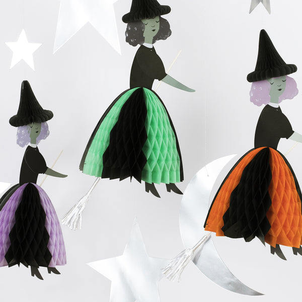 Our Halloween hanging decorations feature happy witches with honeycomb details, and shiny silver stars and a moon. Image3