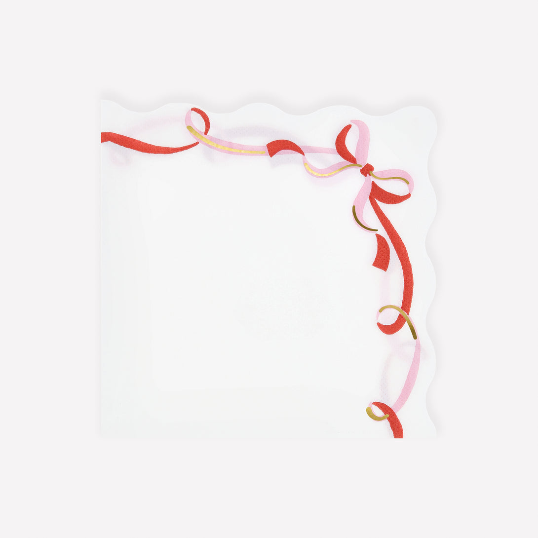 Our 3-ply paper napkins, feature a red, pink and gold ribbon bow design, perfect for a stylish Christmas dinner or party. Image1