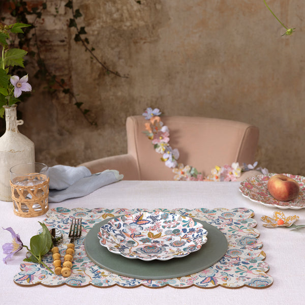 Our large placemat is crafted in a rectangular shape with a scalloped edge, pretty floral Liberty print design, cork back and laminated finish. Image2