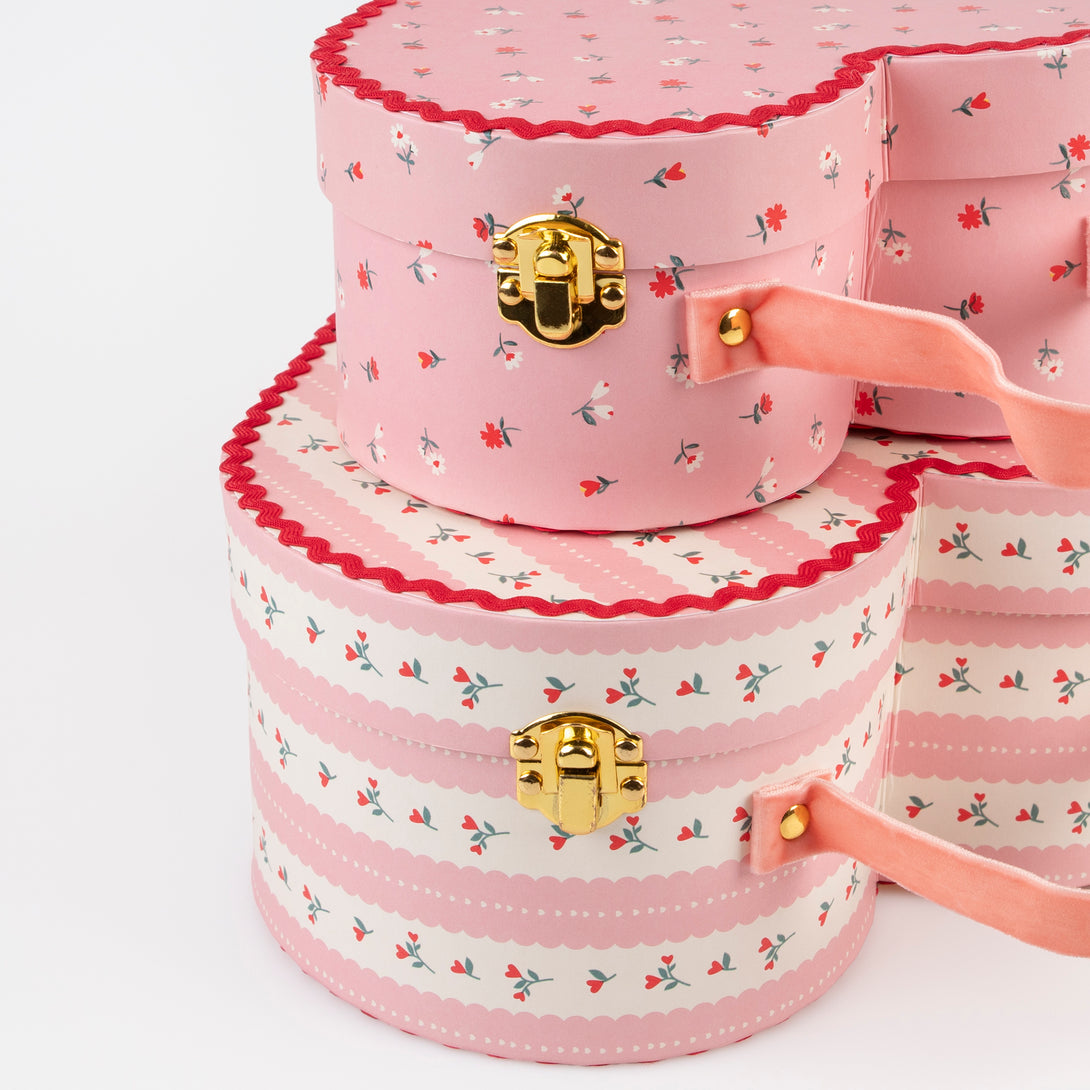 Our kids accessories feature heart suitcases in pink, red and white with soft velvet handles.