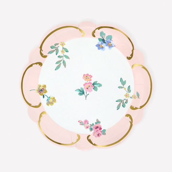 Our paper plates, made in a small size, feature a pastel pink border, posy designs, shiny gold foil details and a wavy border, super stylish. Image1