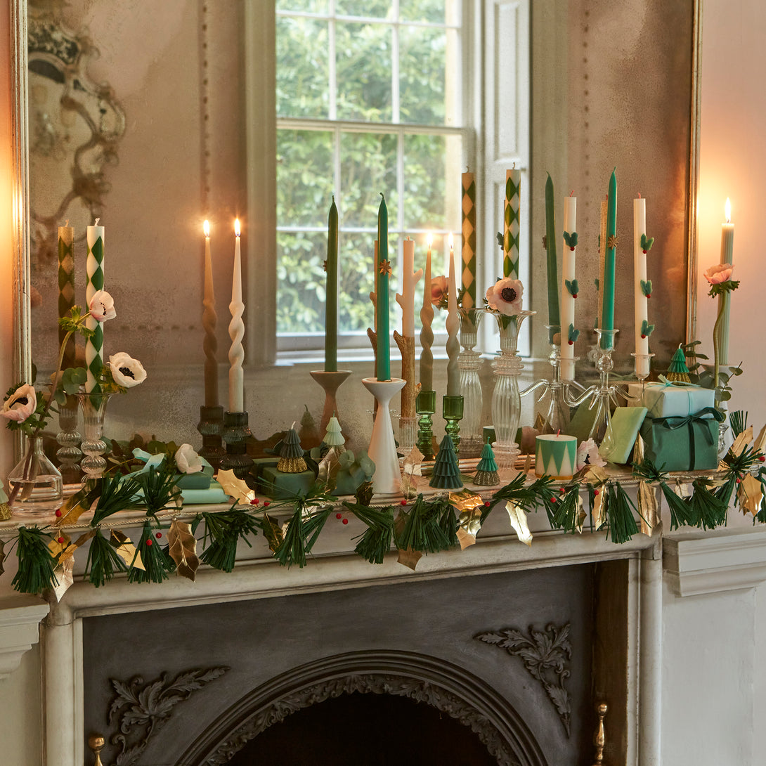 Our festive garland includes holly, berries and pine needles crafted from paper and wooden beads for a special Christmas foliage look.