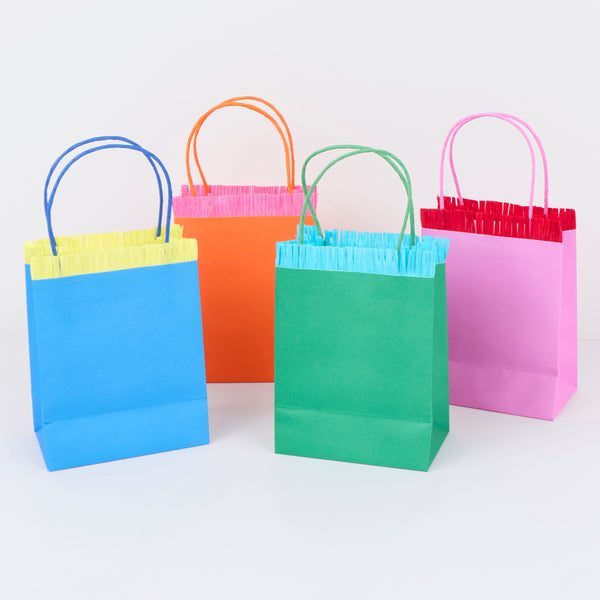 Our party favour bags come in eight vibrant colours, with matching twisted paper handles and delightful crepe paper fringing. Image3