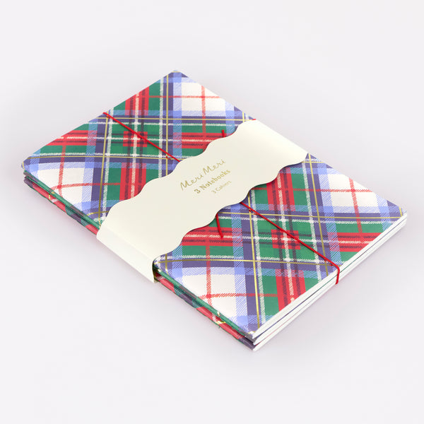 Our notebook set features 3 softcover notebooks with tartan designs in Christmas colours, perfect for someone who loves to write. Image1