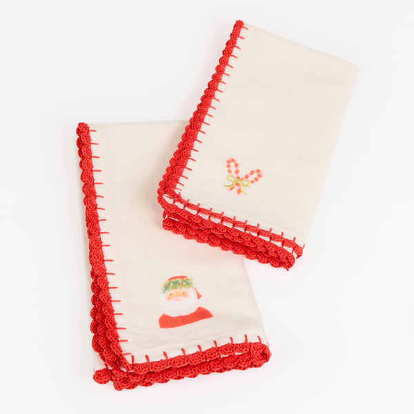 Our Christmas fabric napkins are made from an ivory linen and cotton blend, with festive motifs, embroidered details and crochet borders. Image5