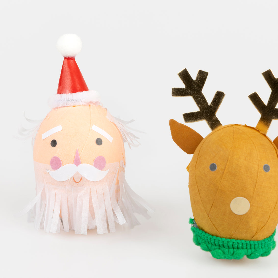Our surprise balls, in the shape of Santa, a snowman and a reindeer, contain a gold party hat, 2 stickers, a joke and a fun eraser. Image3