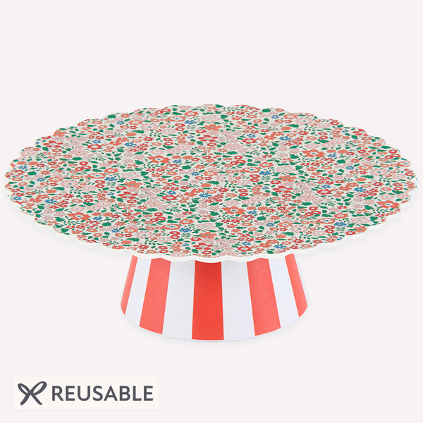 Our Christmas cake stand features a Liberty floral print design, with a striped base, ideal for displaying festive cakes and a lovely host gift. Image1