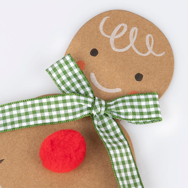 Our Christmas card, in the shape of a gingerbread man with a gingham ribbon bow, makes a great Christmas mantel decoration. Image2
