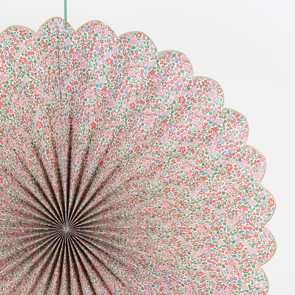 Our Christmas hanging decorations set features 3 paper Liberty floral print pinwheels with velvet hanging ribbons, perfect for an elegant look. Image3