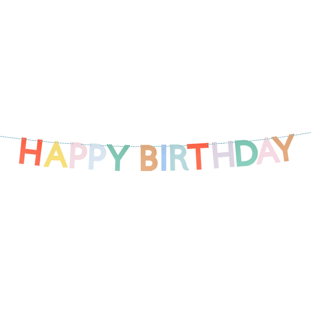 Our Happy Birthday garland, made with bright paper letters with scalloped details, adds a stylish and colourful decoration.