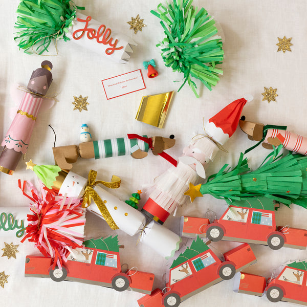 Our luxury Christmas crackers, with Santa, reindeer and tree designs, include a paper hat, joke and a Guess Who game. Image3