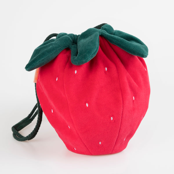 Our accessories for kids range includes a stunning strawberry bag crafted from soft velvet.