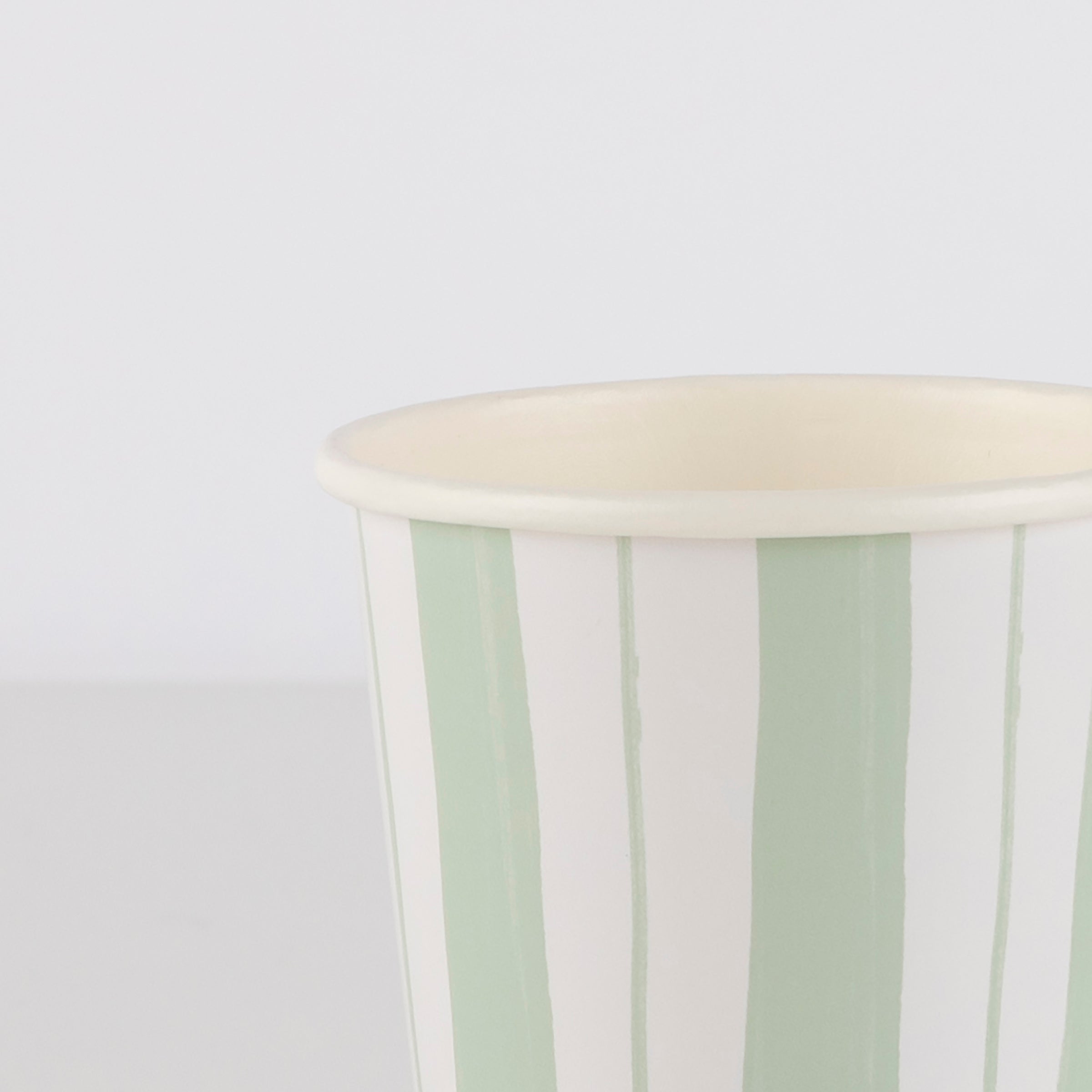Our paper party cups feature blue, pink and green ticking stripes.