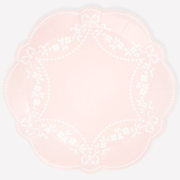 Our paper plates, in pastel pink dinner plate size, feature an ornamental white Rococo based design, ideal for  baby showers and bridal showers. Image1