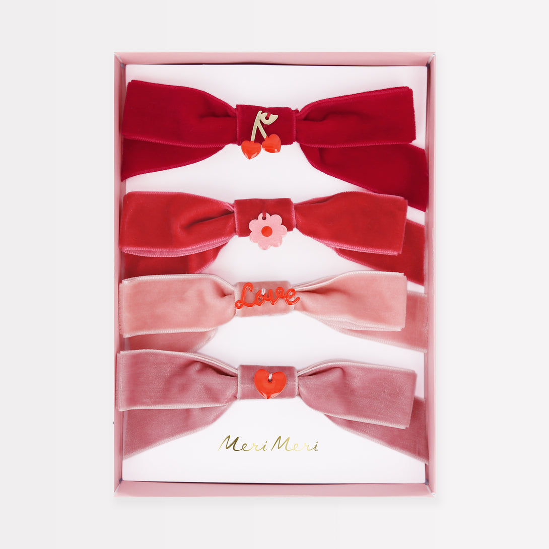 Our Valentine's hair accessories, made with soft velvet bows and enamel charms, make great Valentine's day gifts.